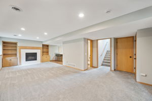 Basement Family Room has built ins and wet bar area
