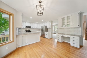 Beautiful kitchen with updates all around. Stone Countertops, Tile backsplash, new SS appliances