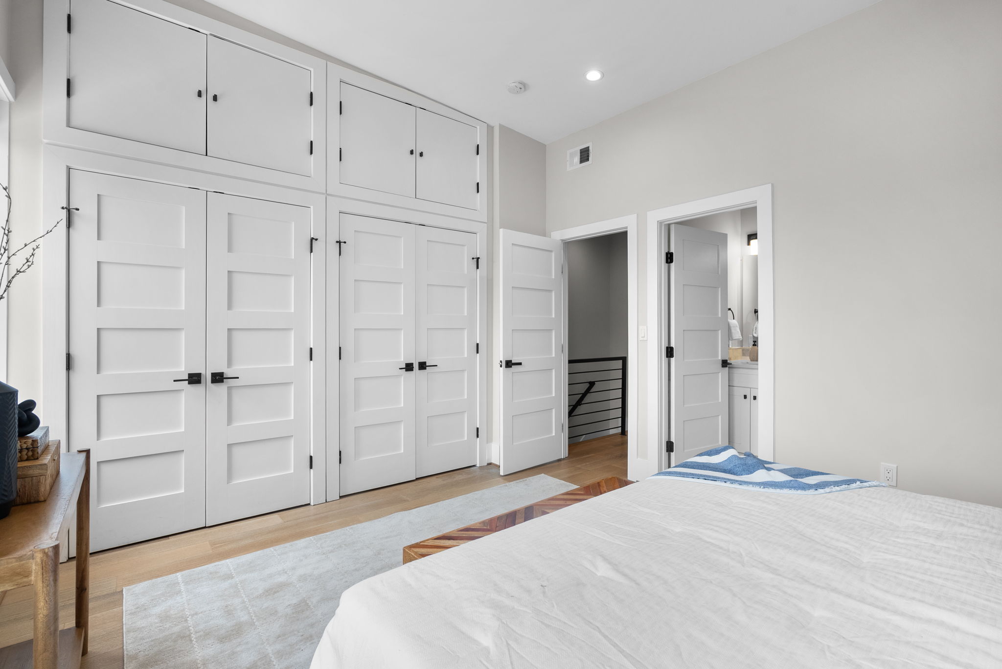 Bedroom with a full wall of built-in closets