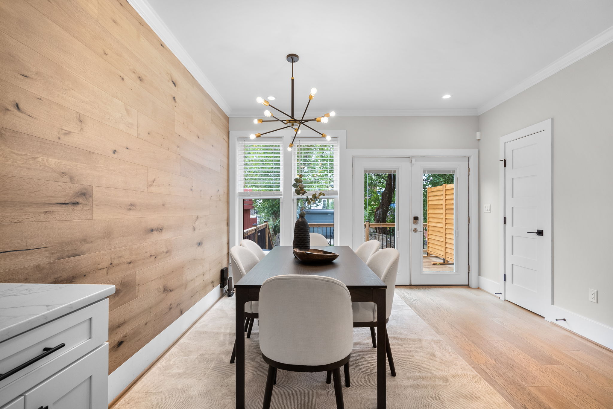 Dining room with a wood accent wall