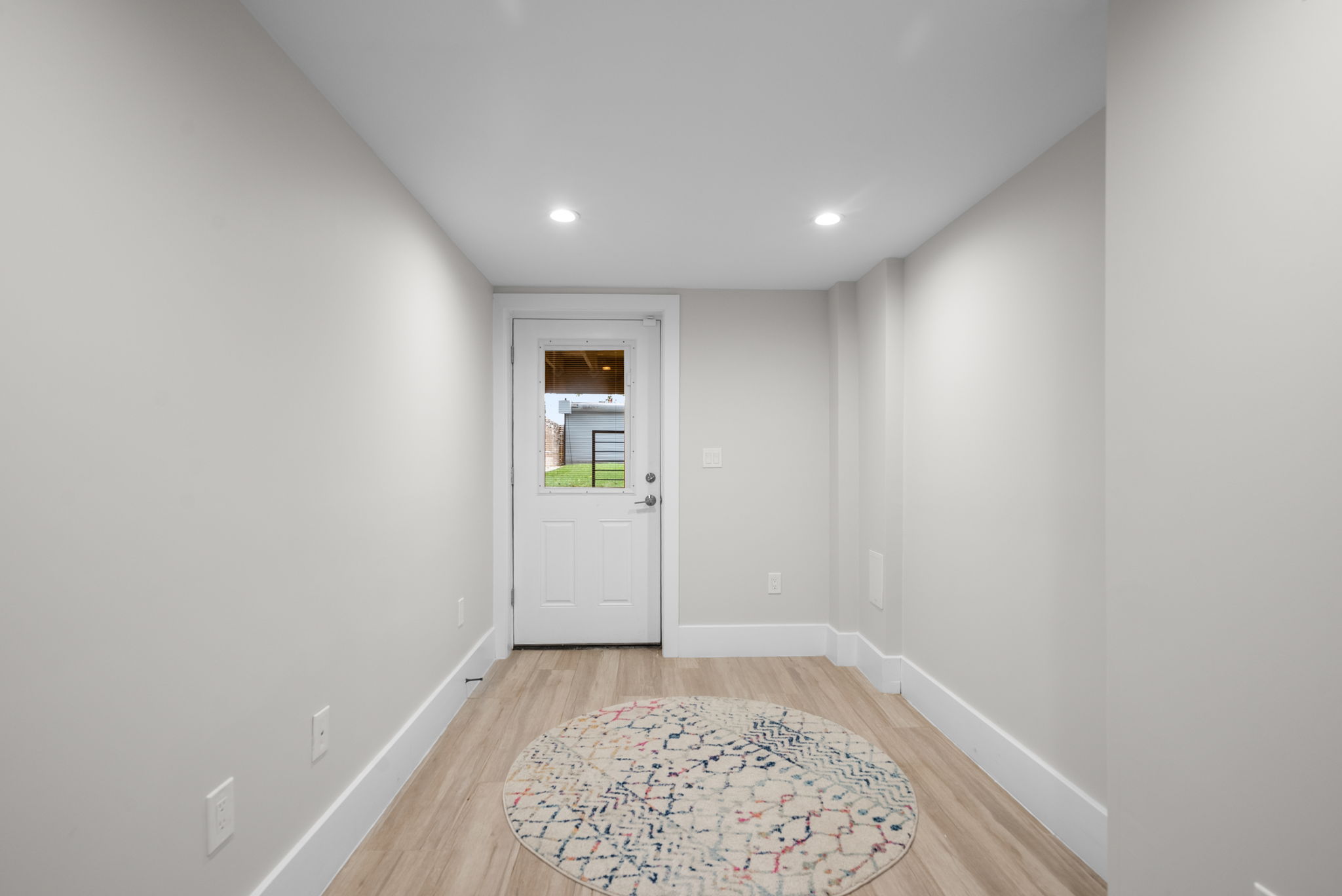 Lower-level hall to the private rear entrance
