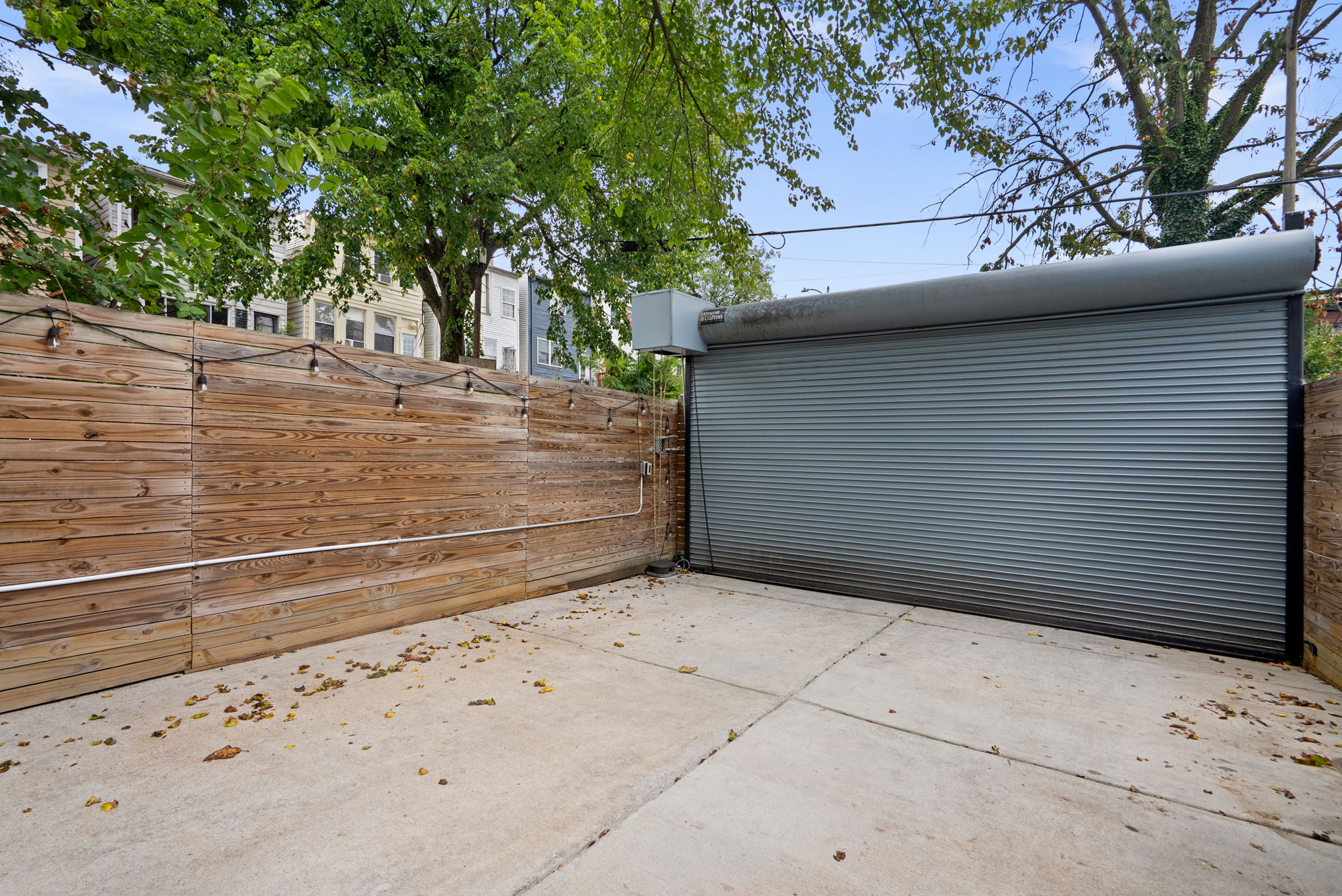 Two off-street parking spaces behind a roll-top door