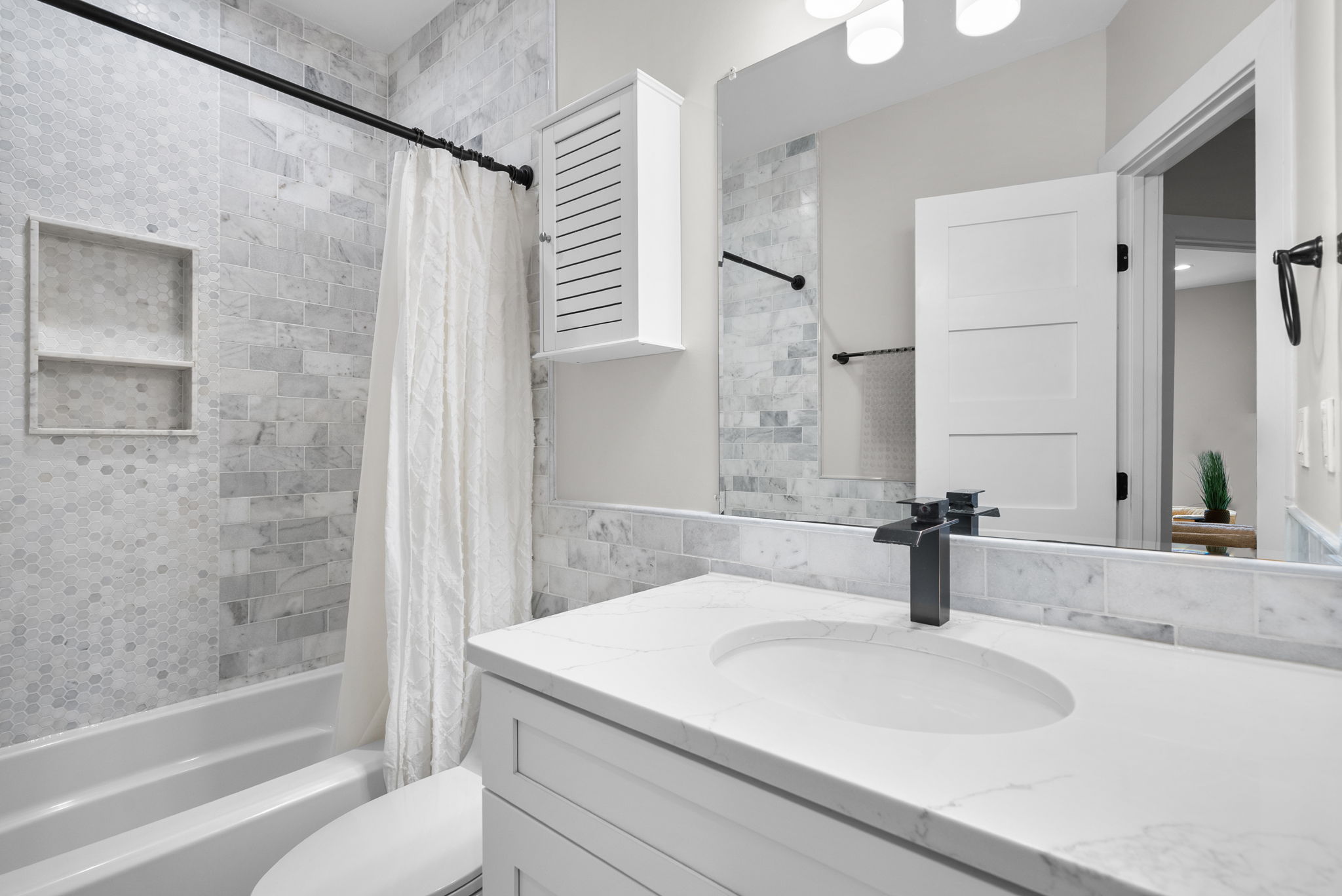 Second upper-level bath with a tub and shower