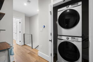 Upper-level laundry with a full-size washer and dryer