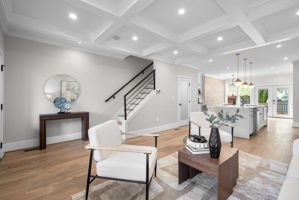 Living room with the stair and kitchen beyond