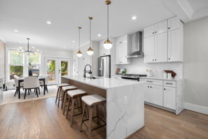 Kitchen with a waterfall island and seating for four