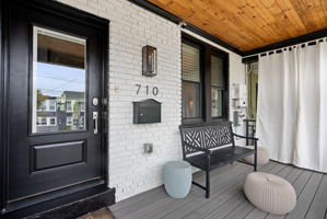 Front porch entry with room to sit