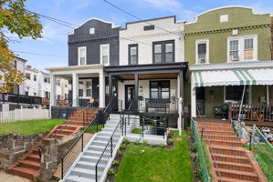 Front steps and a terraced lawn