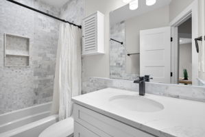 Second upper-level bath with a tub and shower