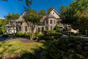 Welcome Home......expansive circular drive and 4 car garage