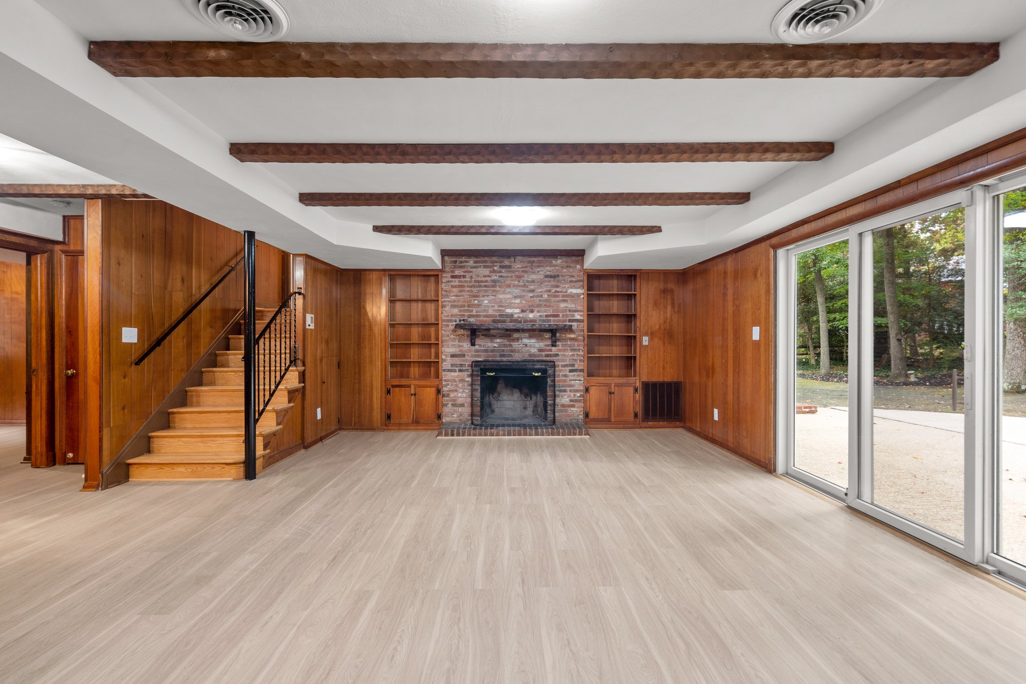 Family Room with Brick Surround Fireplace and Built Ins