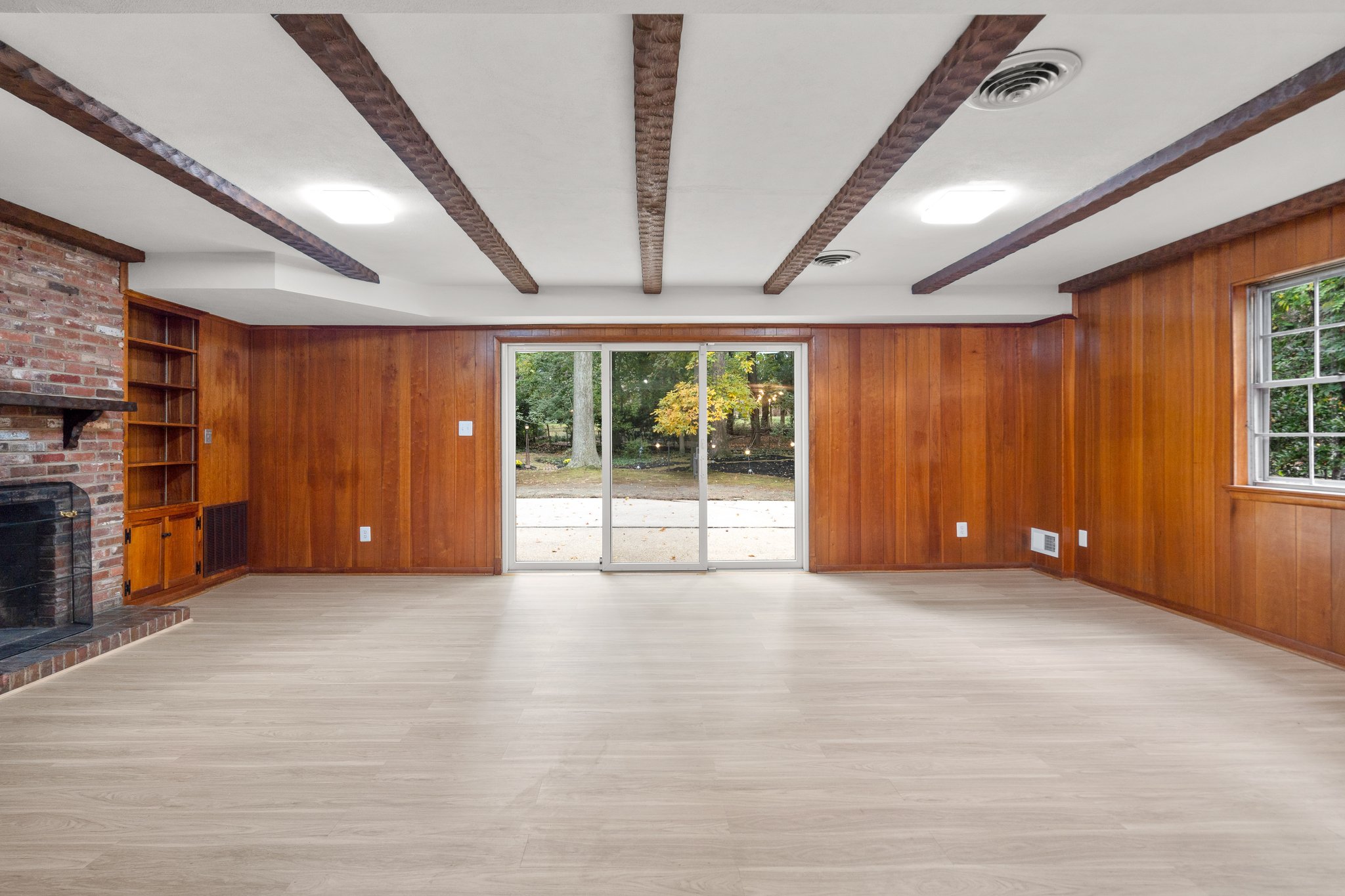 Beamed Ceiling and Sliding Glass Doors to Rear Patio