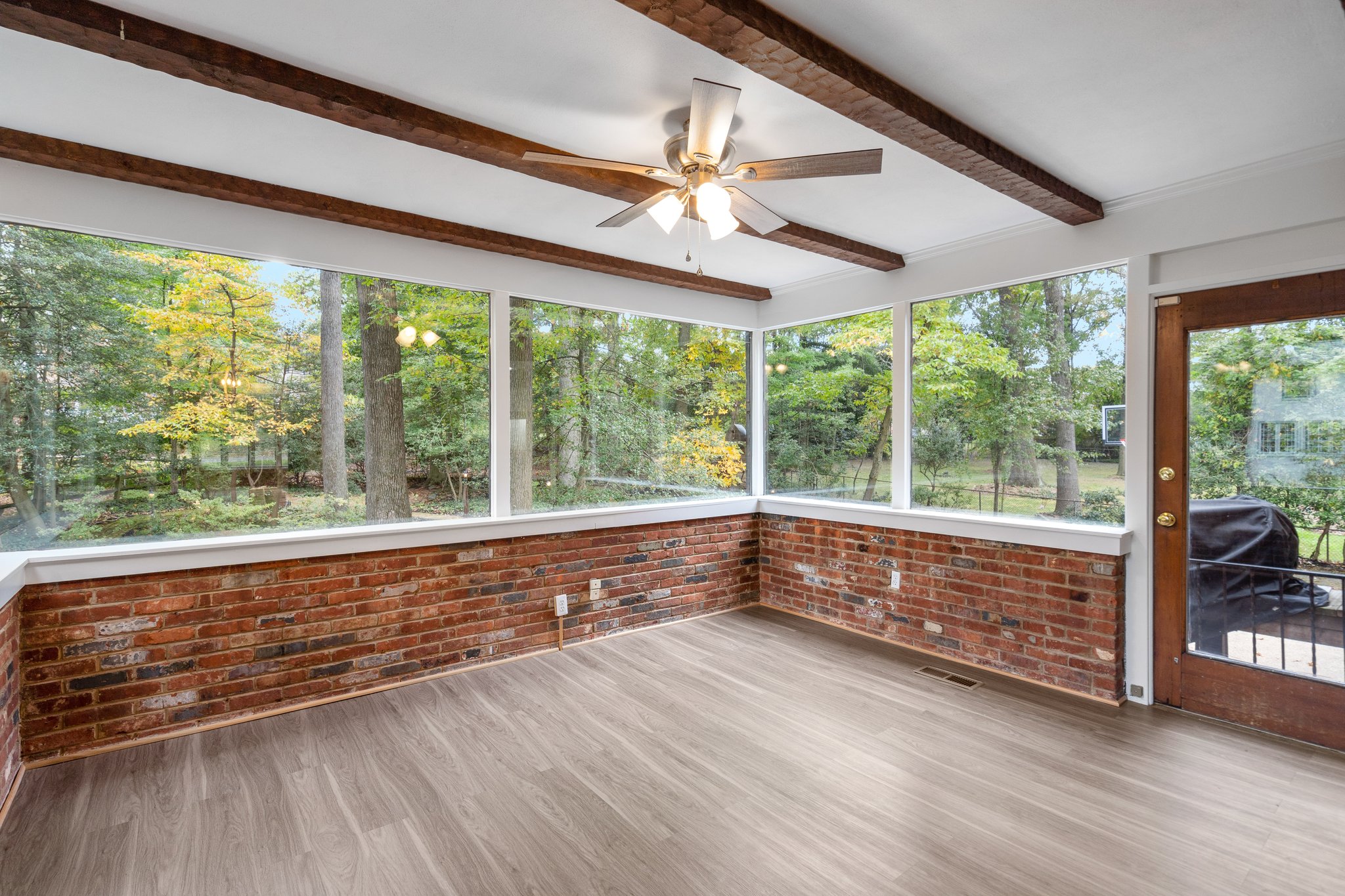 Sunroom with Beamed Ceilings, Ceiling Fan and Access to Rear Yard