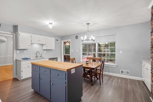 Kitchen with Access to Sunroom, Dining Room and Foyer