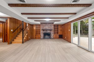 Family Room with Brick Surround Fireplace and Built Ins