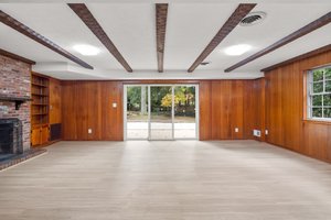 Beamed Ceiling and Sliding Glass Doors to Rear Patio
