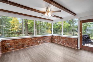 Sunroom with Beamed Ceilings, Ceiling Fan and Access to Rear Yard