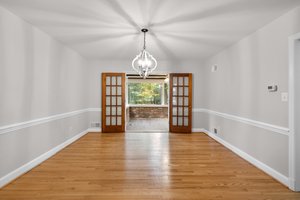 Formal Dining Room with Glass French Door to Sunroom