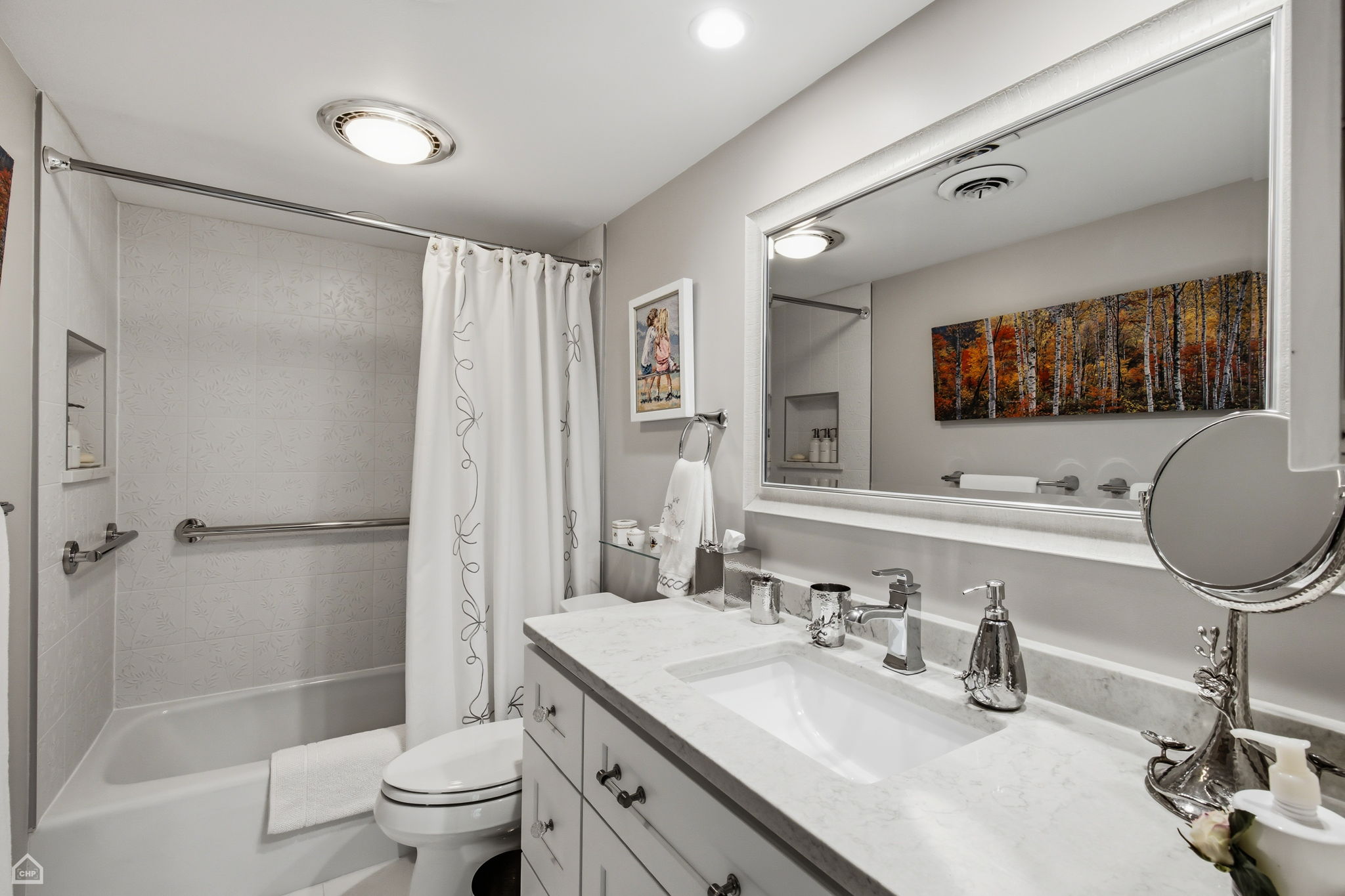 Immaculate second full bath is conveniently located across the hall from second bedroom