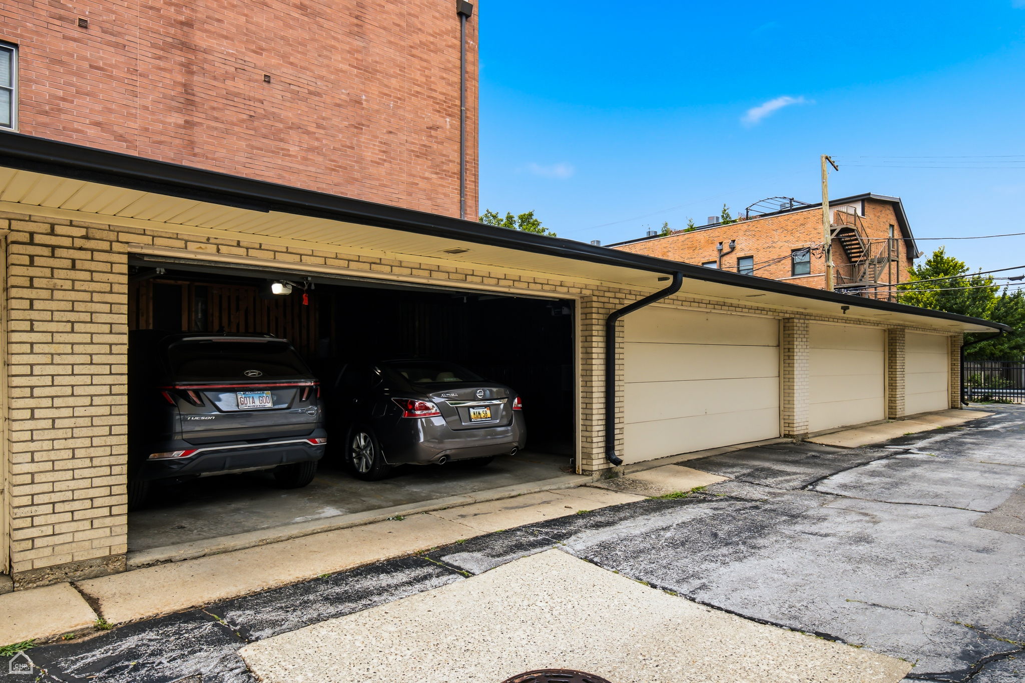 Garage parking space included, with two storage cages