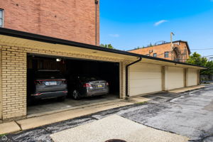 Garage parking space included, with two storage cages