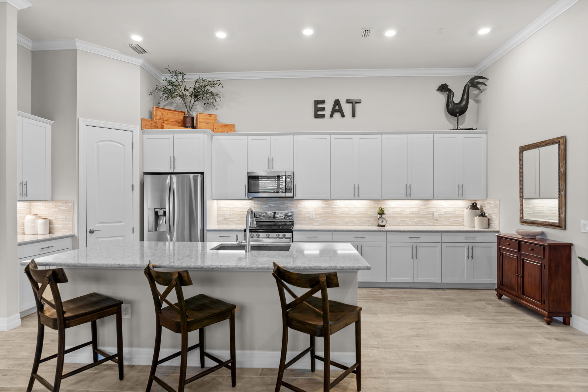 Spacious kitchen with extra cabinetry, walk in pantry, center island, room for a hightop table in kitchen