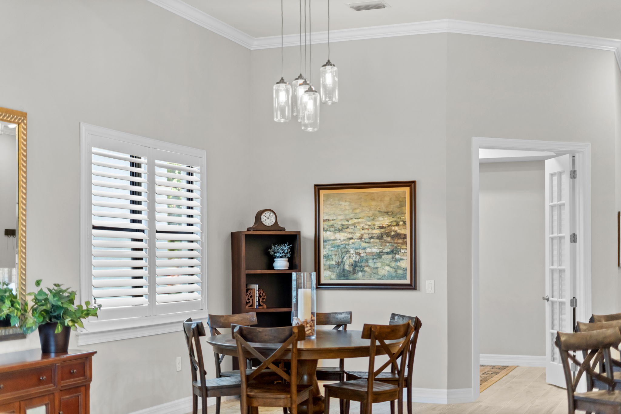 Dining room with tall ceilings and custom chandelier
