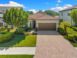 Front exposure with long driveway, sidewalks, beautiful landscaping