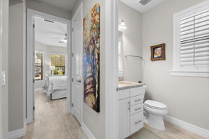 spacious hallway connects guest bedrooms to bathroom
