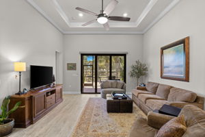 Spacious living room with tray ceiling detail