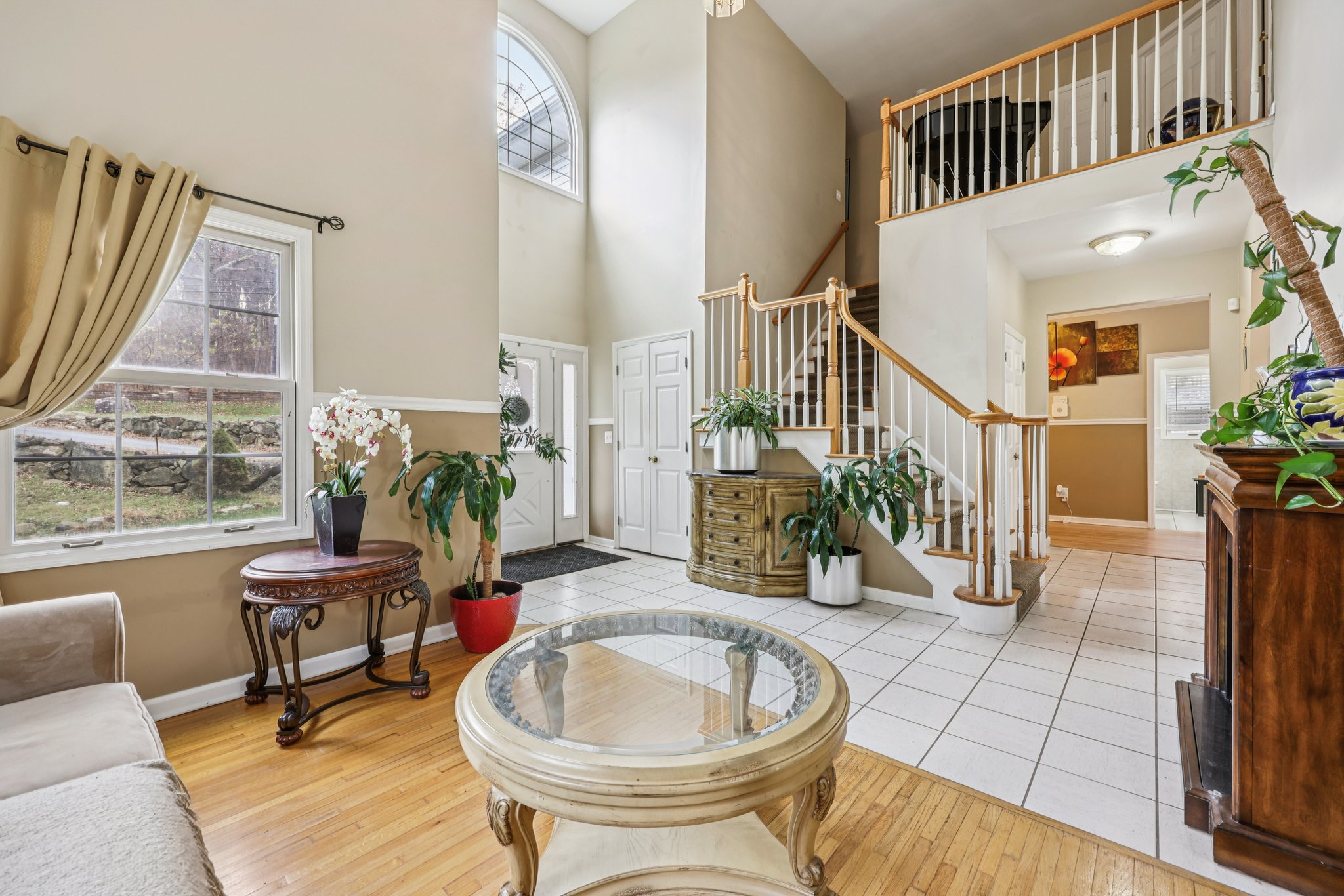 Center stircase overlooks the foyer and formal living room