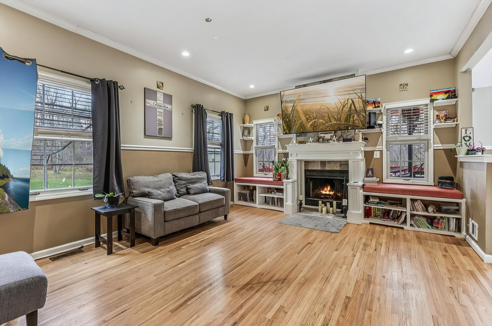Extra large living room with fireplace and built in window seats