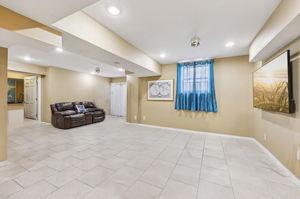 Family room empty- sliding doors walk out to paver patio