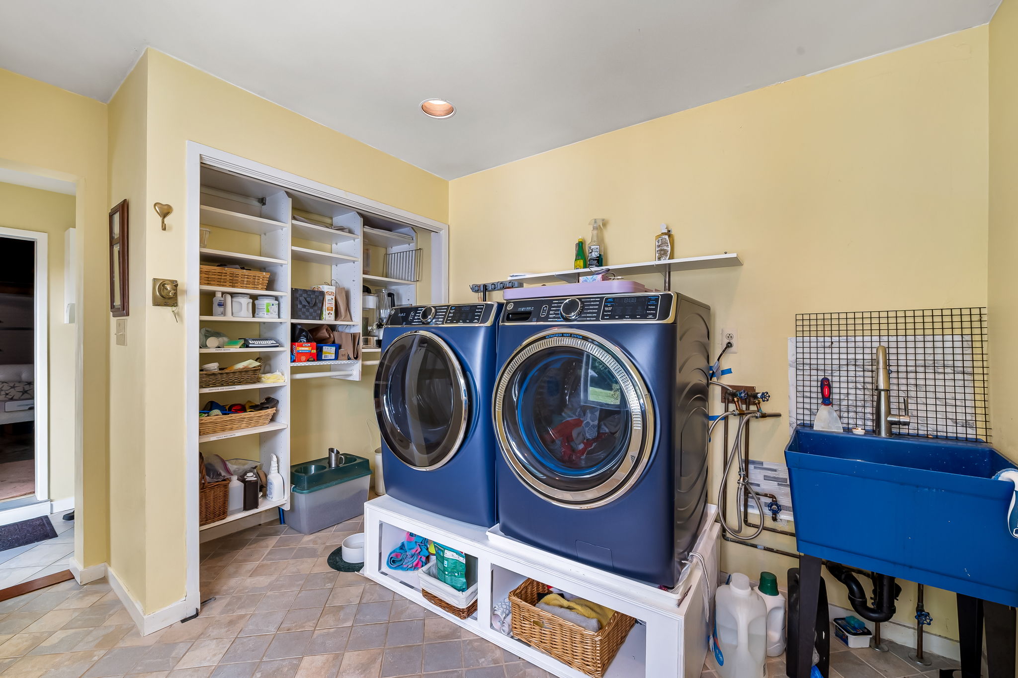 Laundry between mud room and kitchen
