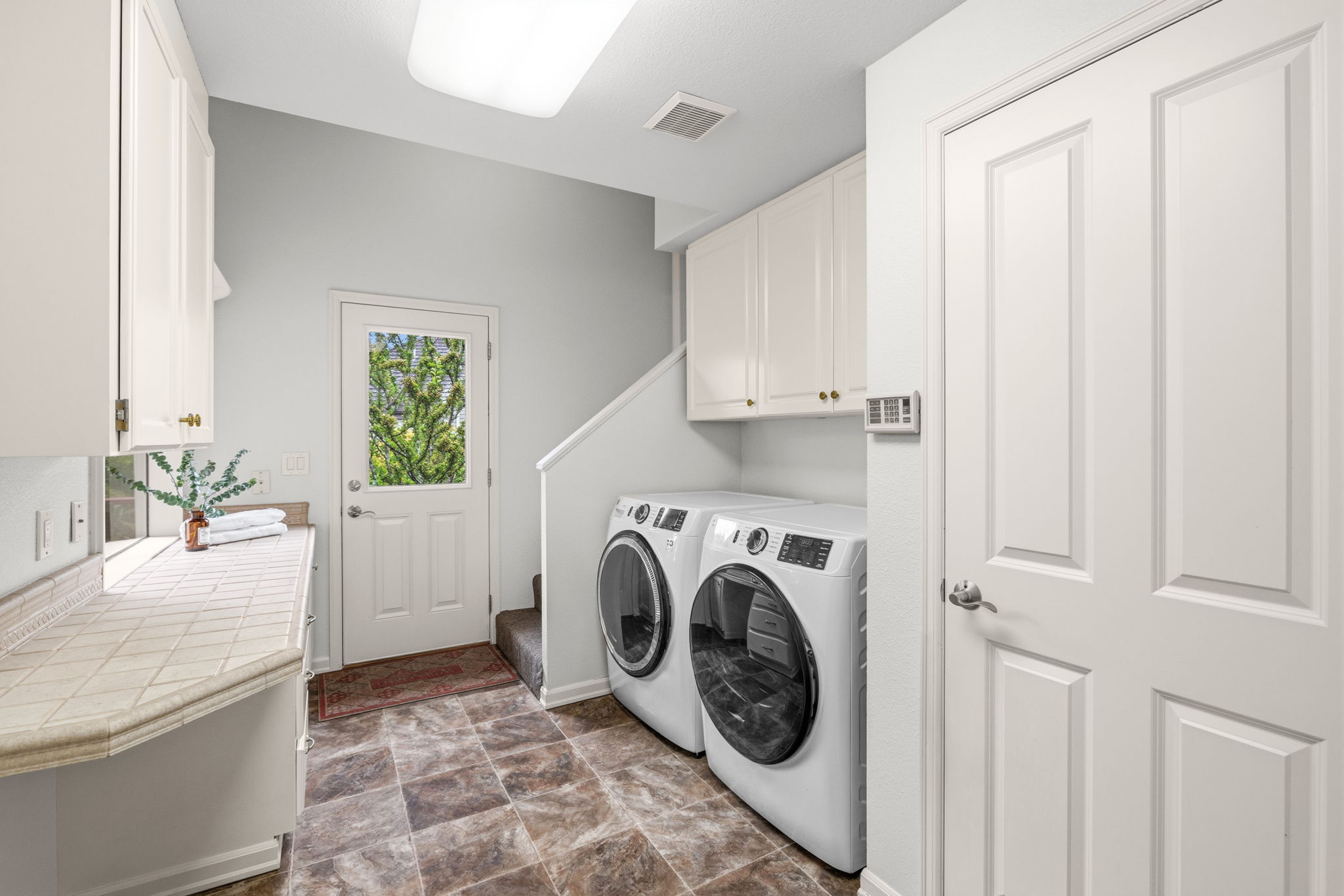 Laundry, large closet & side door