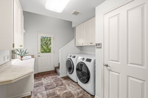 Laundry, large closet & side door