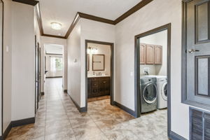 View from central foyer to guest bath & laundry room