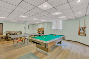Game room with pool and pingpong table. Table to host game nights