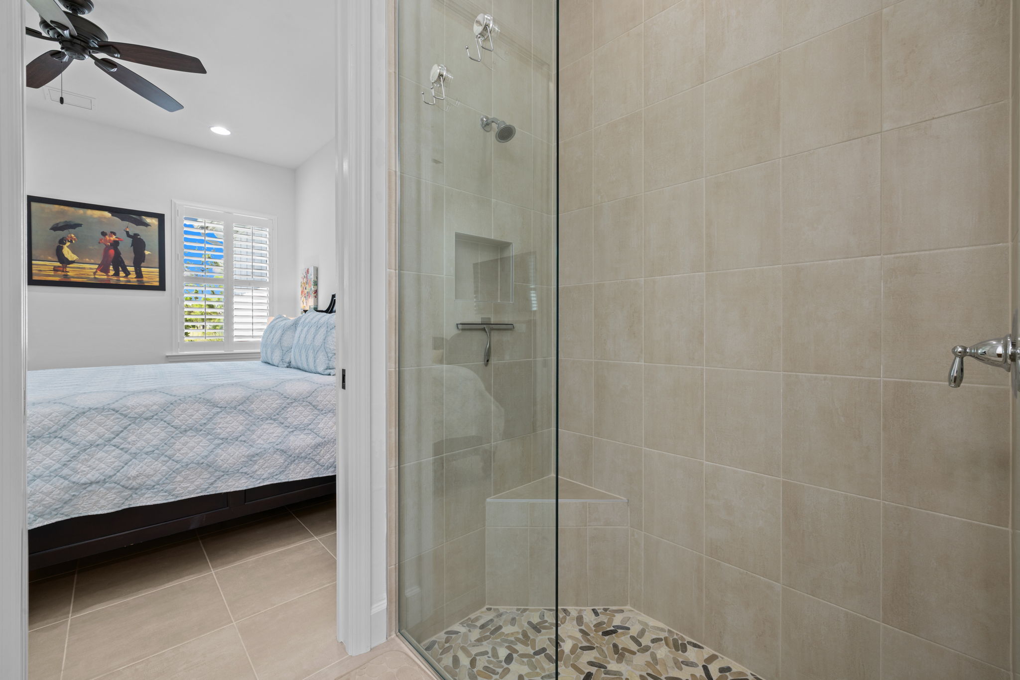Glass door and built in soap & shampoo dish.