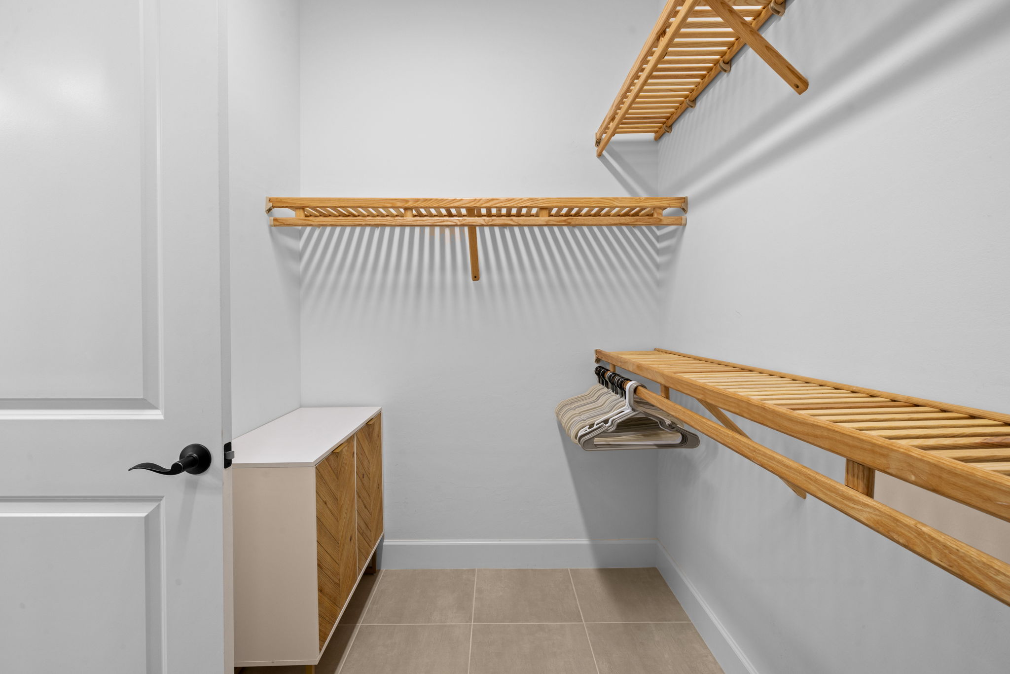 All closets have custom wood shelving.