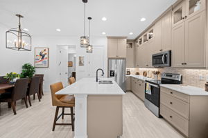 Custom kitchen glass cabinets in kaki.