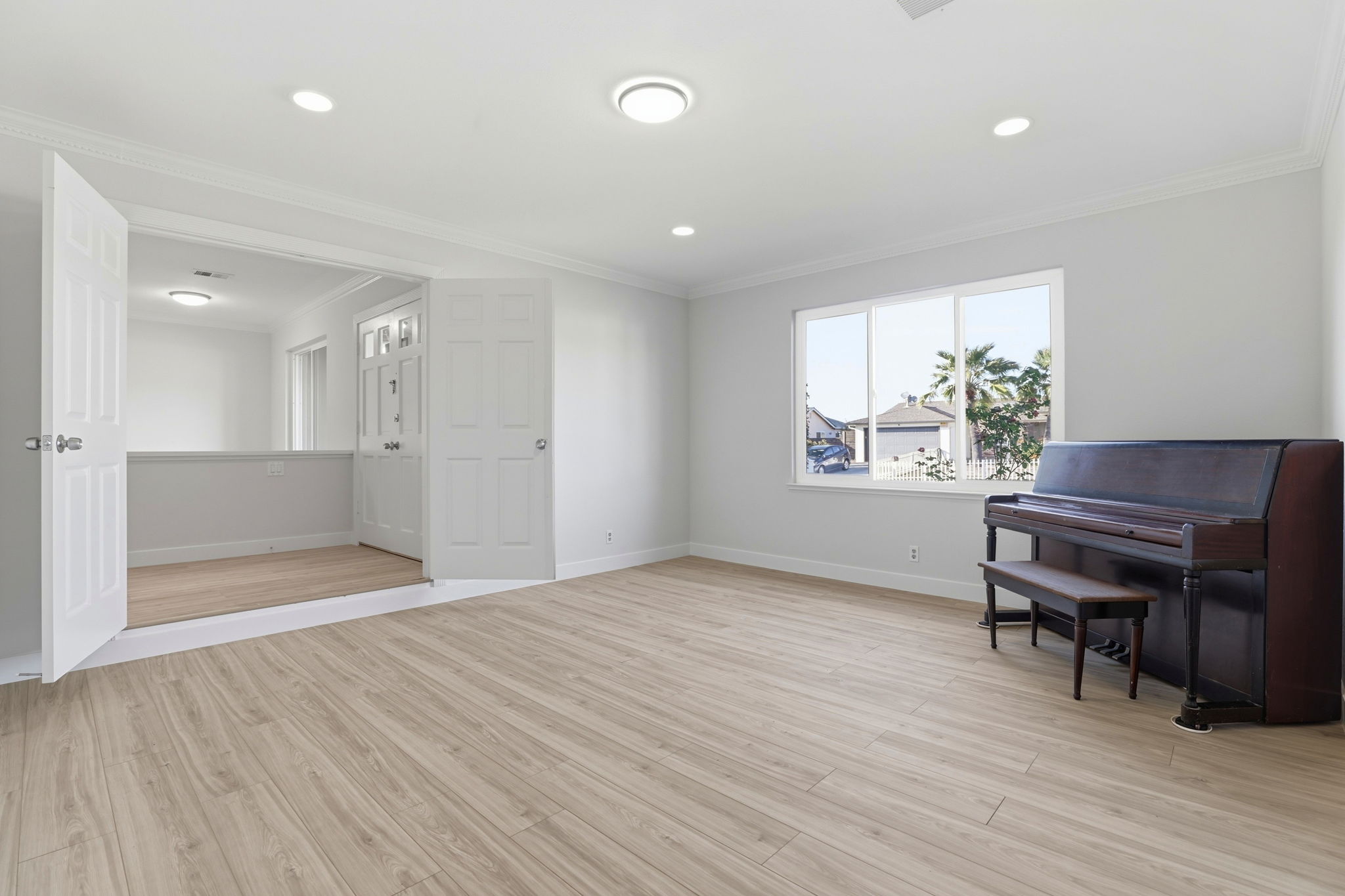Separate Step Down Living Room with Luxurious Layered Crown Molding!!