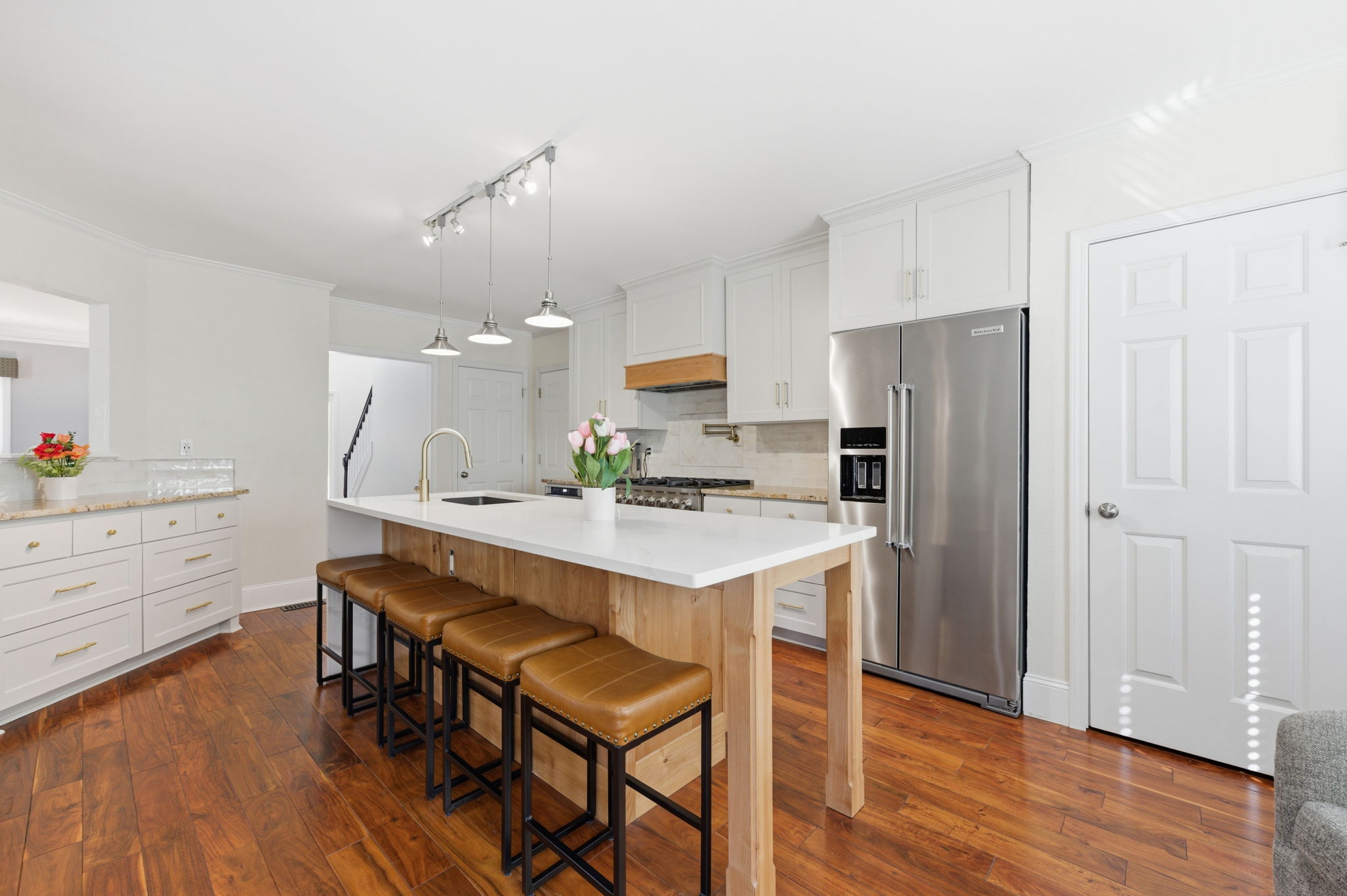 Kitchen with Custom Appliances and Quartz Island