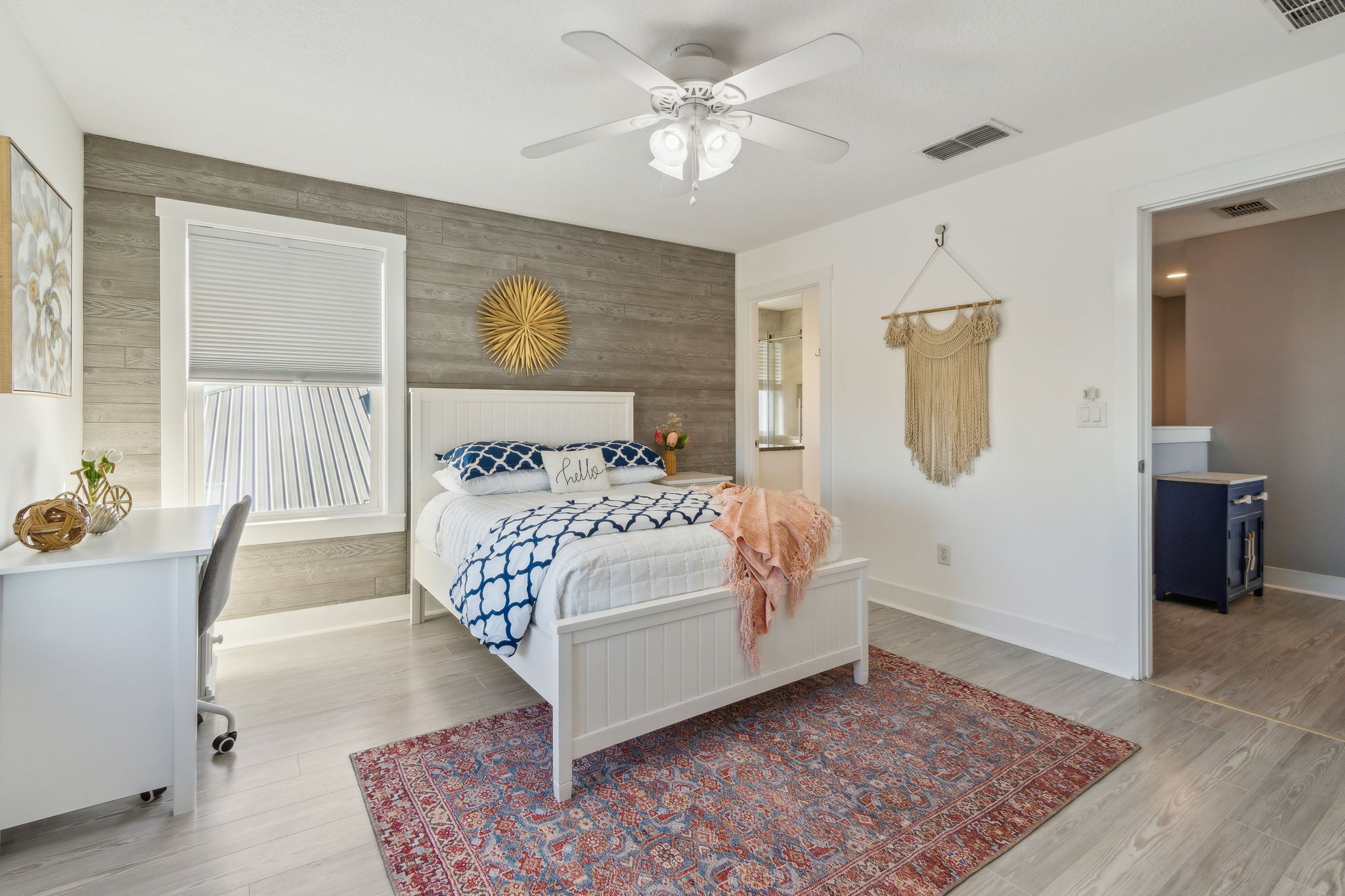 ...and feature a natural wood-grain accent wall that exudes a breezy beach vibe.