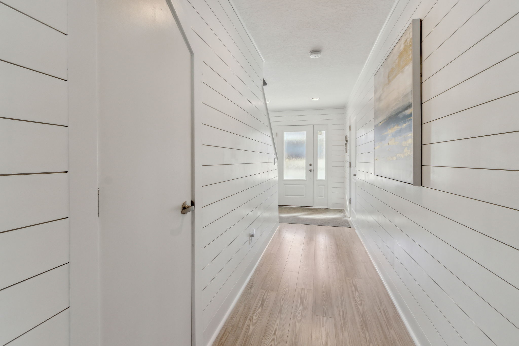 The house features two spacious storage areas, with the pictured door leading to one of them.