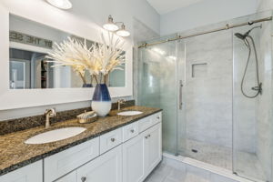 Spa-inspired, the master bath features a spacious tiled shower ...