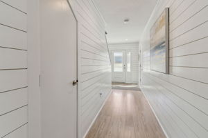 The house features two spacious storage areas, with the pictured door leading to one of them.