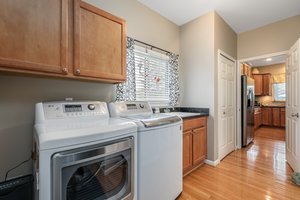 Laundry area with large closet