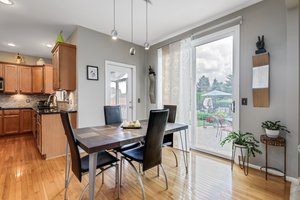Eating area leads to screened in porch