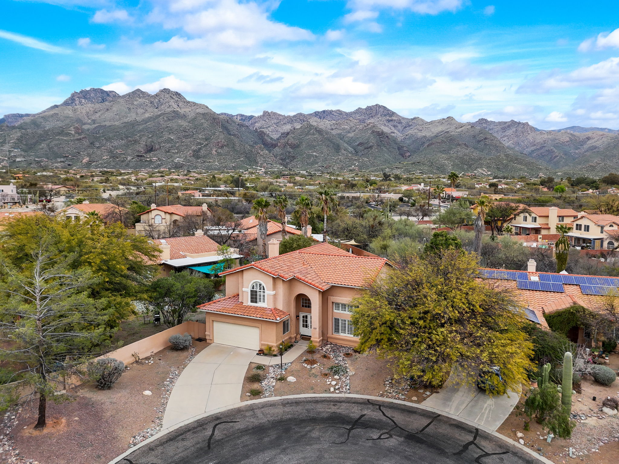 Drone view of home, side yard and mountains